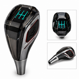 LED gear knob close-up showing illuminated 5 speed pattern and crystal design