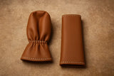 Brown black beige leather gear and hand brake covers close-up