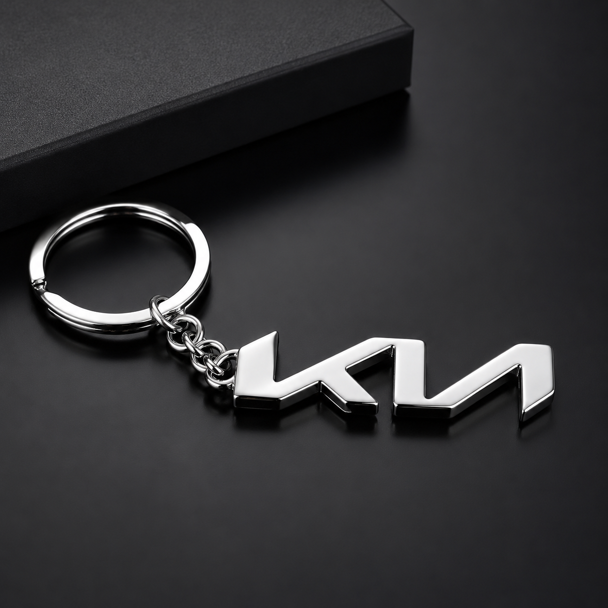 Metal keychain with a logo on a black background