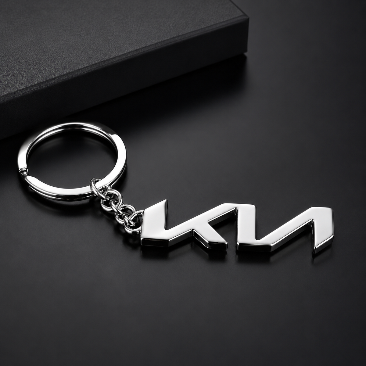 Metal keychain with a logo on a black background