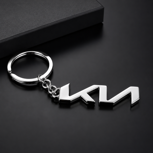 Metal keychain with a logo on a black background