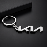 Metal keychain with a logo on a black background