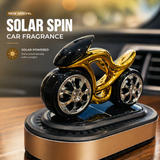Solar powered car fragrance diffuser with rotating rims in gold and black finish for car dashboard
